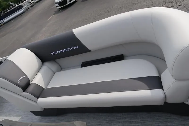 Slide: The Image of 2026 Bennington S Swingback 22 SSB boat interior with modern seating and console. - 9