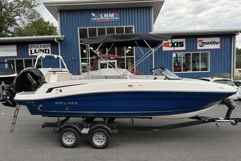 The Image of 2026 Bayliner VR6 Bowrider OB boat on trailer at dealership. - 1
