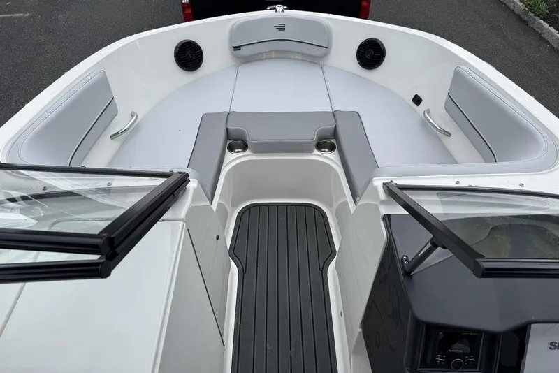 Slide: The Image of 2026 Bayliner VR6 Bowrider OB interior with seating and cup holders. - 5