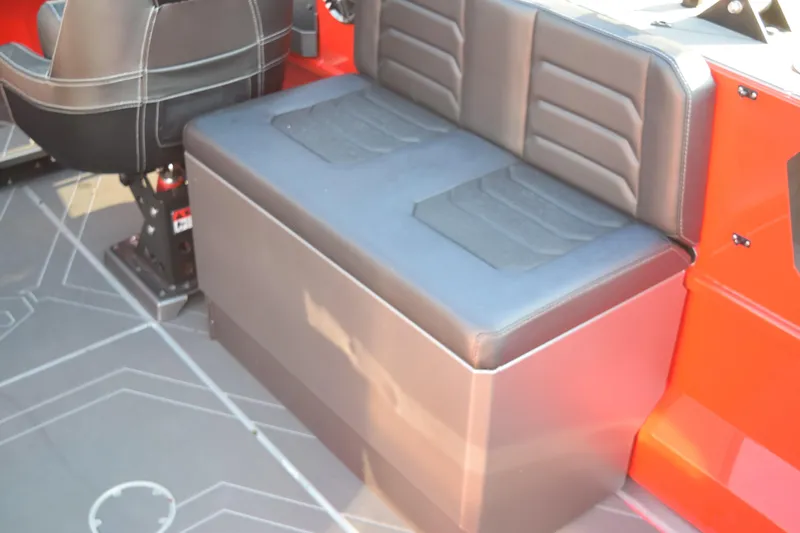 Slide: The Image of Interior seating of 2025 Stabicraft 2050 Treker Profish boat, featuring cushioned bench and chair. - 12