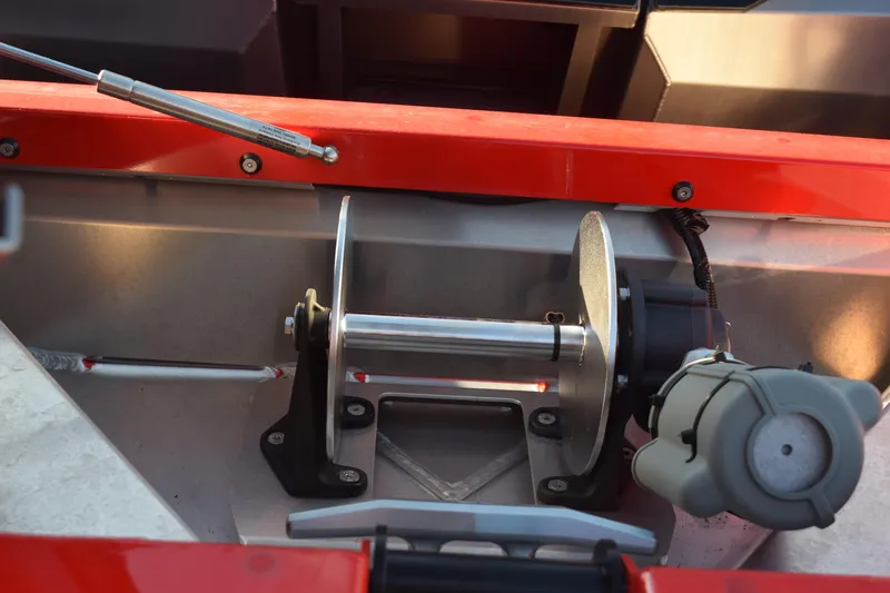 Slide: The Image of 2025 Stabicraft 2050 Treker Profish boat winch detail, featuring red and metallic components. - 16
