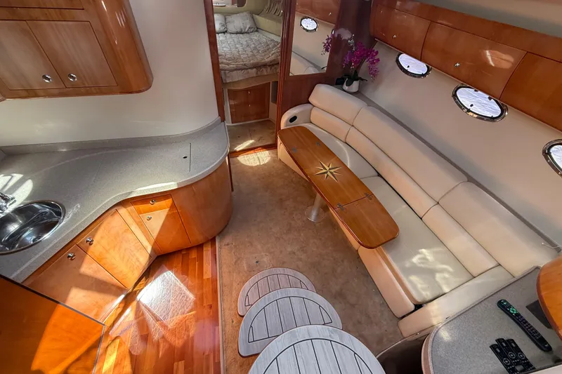 Slide: The Image of Luxurious interior of 2004 Regal Commodore 3860 yacht with elegant seating and kitchenette. - 10