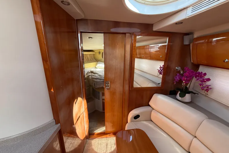 Slide: The Image of Luxurious interior of 2004 Regal Commodore 3860 yacht with wood finish and elegant seating. - 14