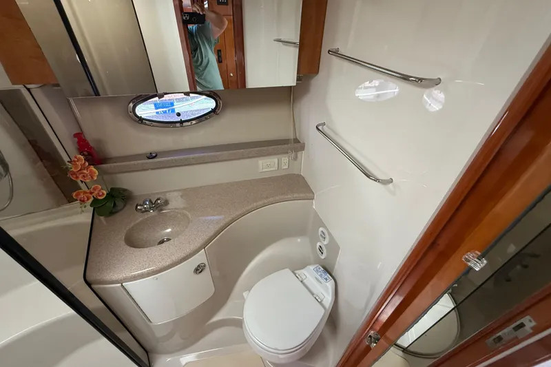 Slide: The Image of Luxurious bathroom in 2004 Regal Commodore 3860 yacht with modern fixtures and elegant design. - 16