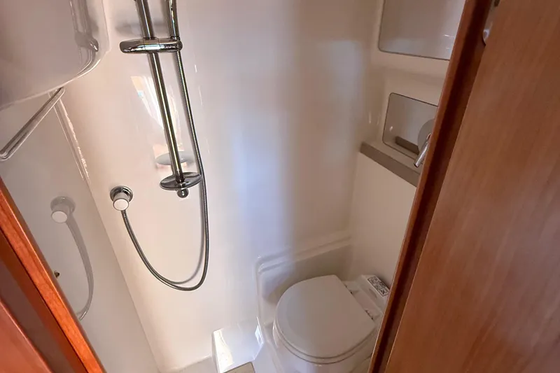Slide: The Image of Bathroom interior of 2004 Regal Commodore 3860 yacht with shower and toilet. - 22