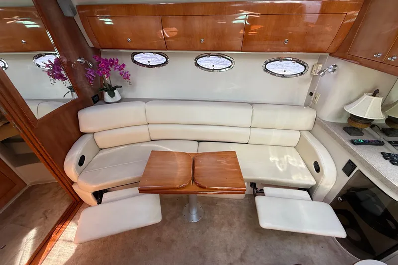 Slide: The Image of Luxurious interior of 2004 Regal Commodore 3860 yacht with plush seating and elegant decor. - 24