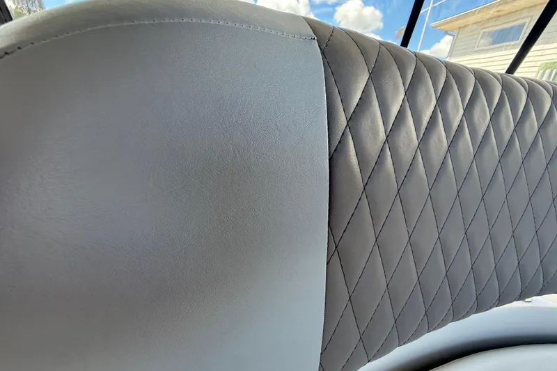 Slide: The Image of Close-up of 2004 Regal Commodore 3860 seat with diamond-stitched leather upholstery. - 27