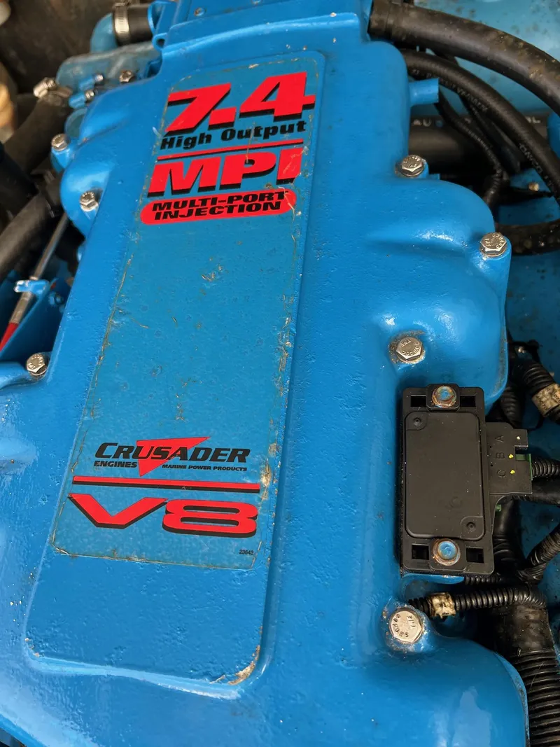 Slide: The Image of Close-up of a blue 7.4L V8 Crusader engine in a 2002 Carolina Classic 25 Classic boat. - 11