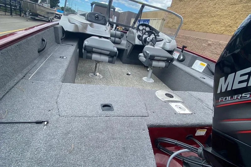 Slide: The Image of 2014 Tracker Pro Guide V-175 Combo boat interior with seating and controls. - 6