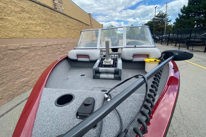 Slide: The Image of 2014 Tracker Pro Guide V-175 Combo boat with red exterior and fishing equipment. - 7