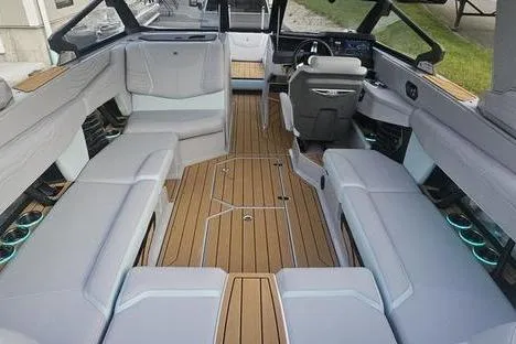 Slide: The Image of 2025 Nautique Super Air Nautique G23 interior with sleek seating and modern design. - 2