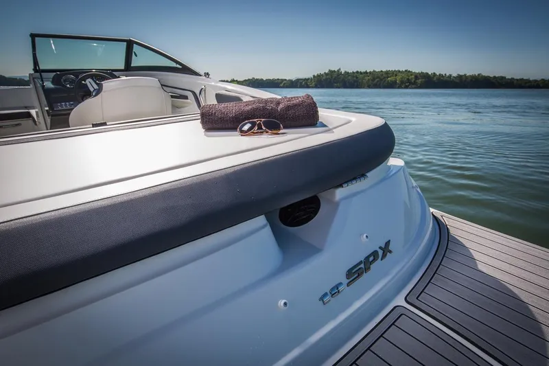 Slide: The Image of Manufacturer Provided Image: 2018 Sea Ray SPX 190 boat on a lake with towel and sunglasses. - 10