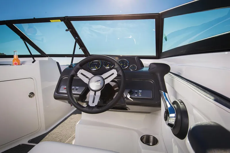 Slide: The Image of Manufacturer Provided Image: 2018 Sea Ray SPX 190 boat cockpit with steering wheel and dashboard. - 7