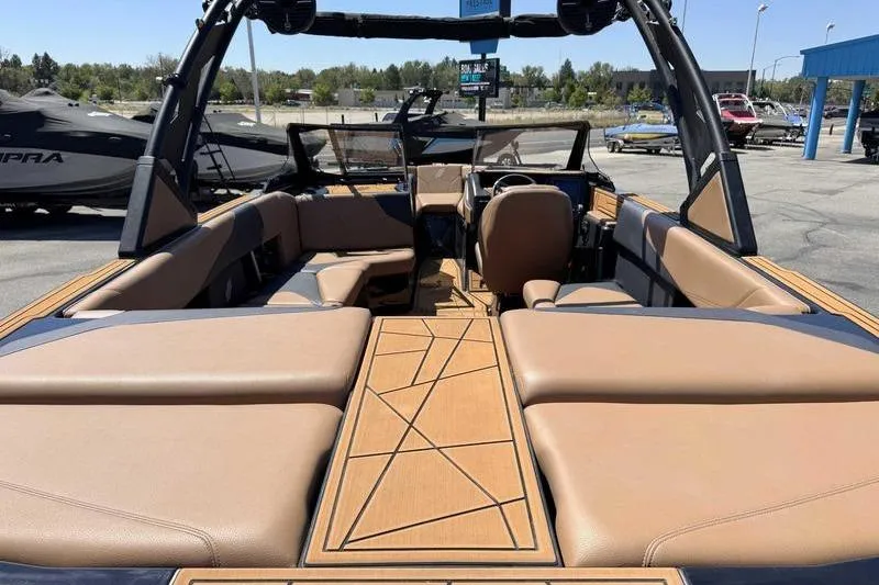 Slide: The Image of 2021 ATX Surf Boats 24 Type-S interior with tan seating and modern design. - 10