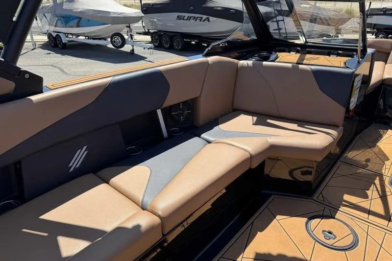 Slide: The Image of 2021 ATX Surf Boats 24 Type-S interior with tan and gray seating. - 11
