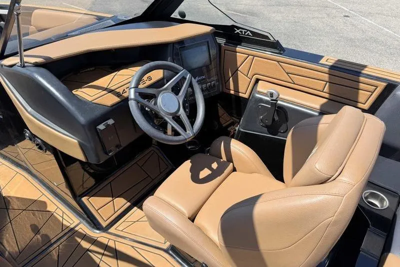 Slide: The Image of 2021 ATX Surf Boats 24 Type-S interior with tan leather seats and modern dashboard. - 12