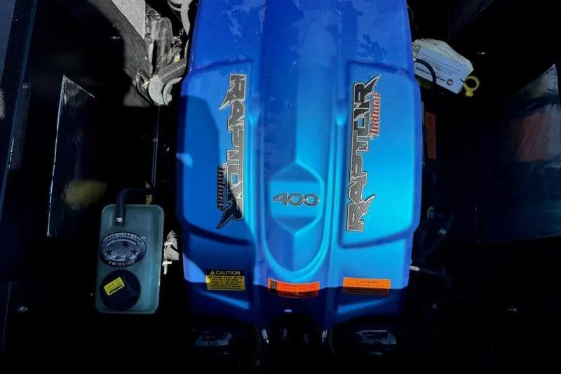 Slide: The Image of 2021 ATX Surf Boats 24 Type-S engine, featuring a blue Raptor 400 cover. - 15
