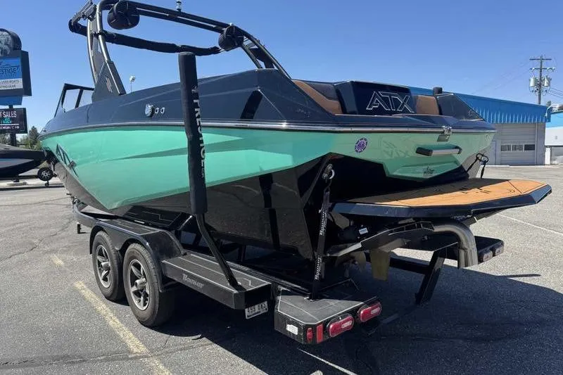 Slide: The Image of 2021 ATX Surf Boats 24 Type-S on trailer, parked outdoors, rear view. - 3