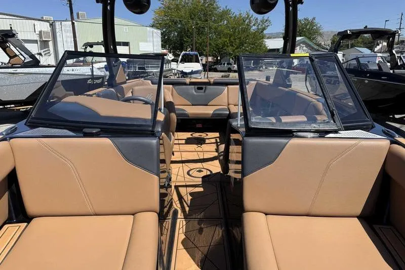 Slide: The Image of 2021 ATX Surf Boats 24 Type-S interior with tan seating and open windshield. - 7