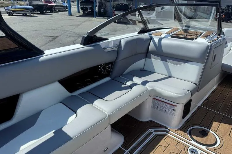 Slide: The Image of 2022 Moomba Mojo boat interior with sleek seating and modern design. - 10