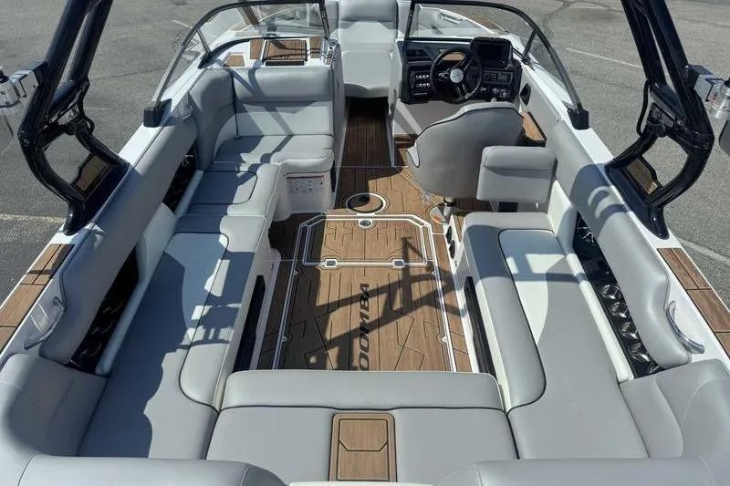 Slide: The Image of 2022 Moomba Mojo boat interior with sleek seating and modern dashboard design. - 7