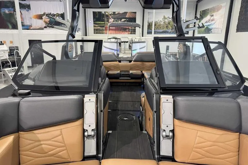 Slide: The Image of 2026 Supra SL boat interior with luxurious seating and modern design in showroom. - 17