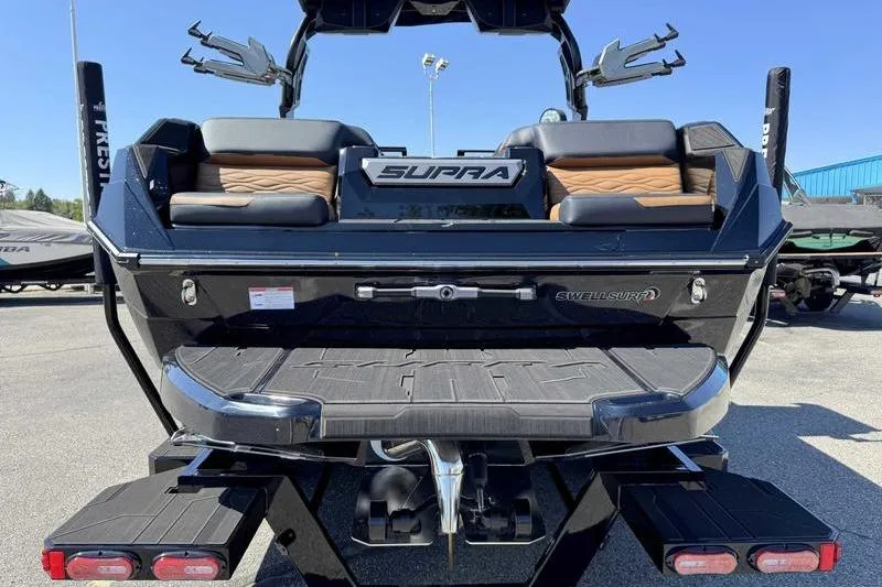 Slide: The Image of 2026 Supra SL boat rear view with seating and Swell Surf system. - 6