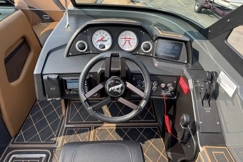 Slide: The Image of Luxurious interior of 2024 MB Alpha 23 boat with tan and black seating. - 10