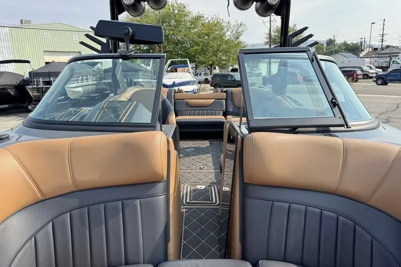 Slide: The Image of Luxurious interior of 2024 MB Alpha 23 boat with tan and black seating. - 13