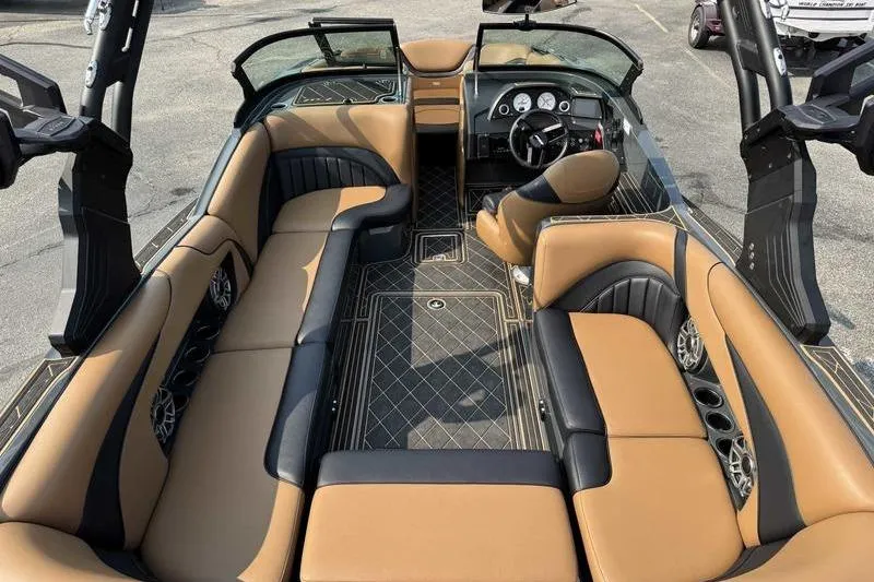 Slide: The Image of 2024 MB Alpha 23 boat on trailer, parked outdoors, showcasing sleek design and modern features. - 6