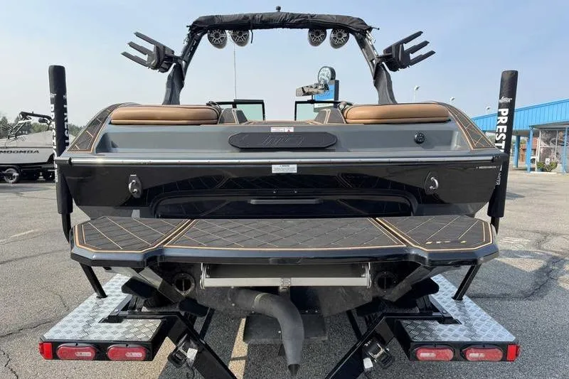 Slide: The Image of Luxurious interior of 2024 MB Alpha 23 boat with tan and black seating. - 8