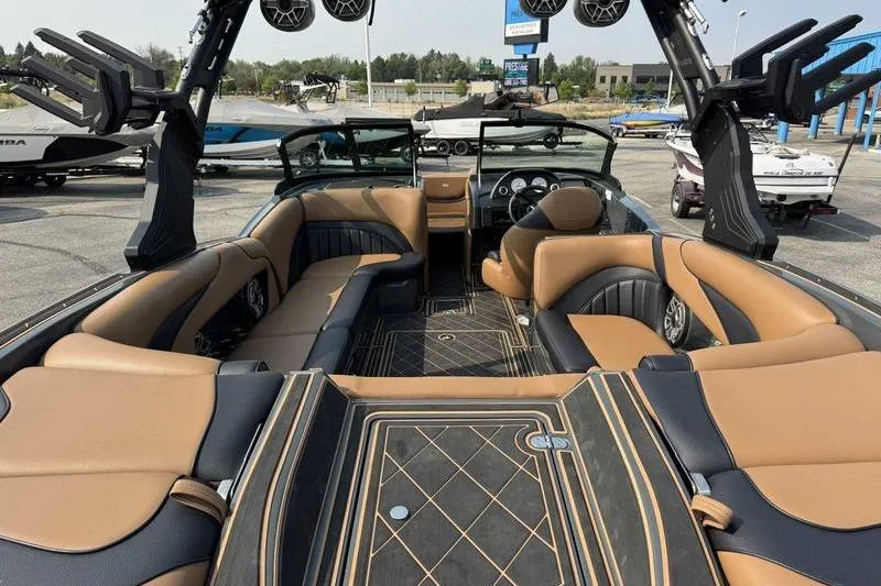 Slide: The Image of 2024 MB Alpha 23 boat dashboard with steering wheel, gauges, and control panel. - 9