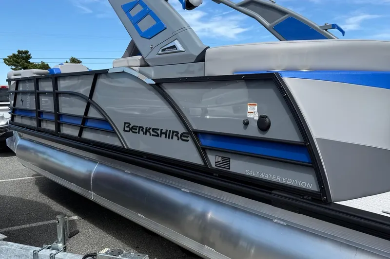 Slide: The Image of 2026 Berkshire 23RFX STS Saltwater Edition pontoon boat, sleek design, parked outdoors. - 5