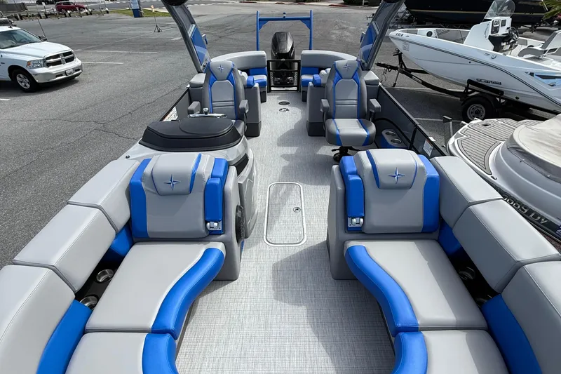 Slide: The Image of 2026 Berkshire 23RFX STS pontoon boat with luxurious blue and gray seating. - 7