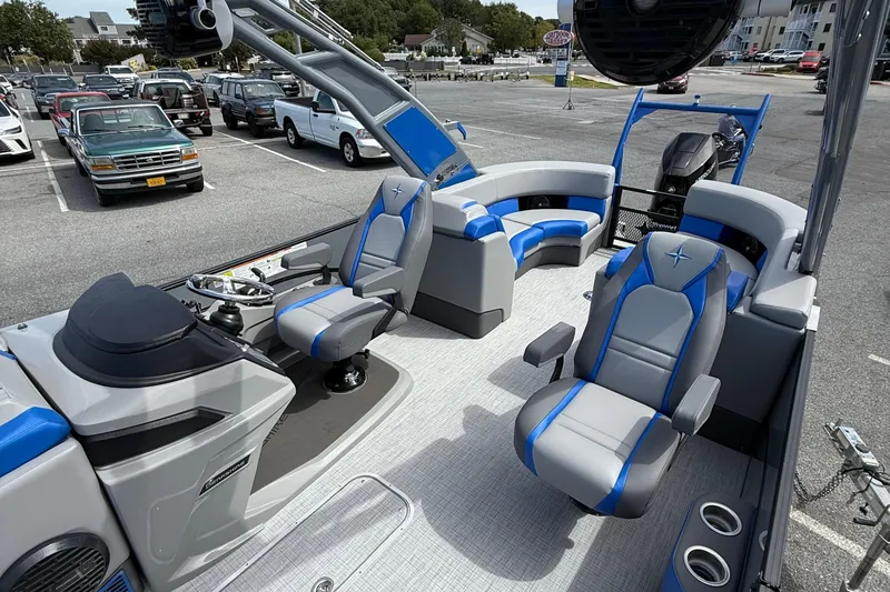 Slide: The Image of 2026 Berkshire 23RFX STS pontoon boat interior with modern seating and steering wheel. - 8