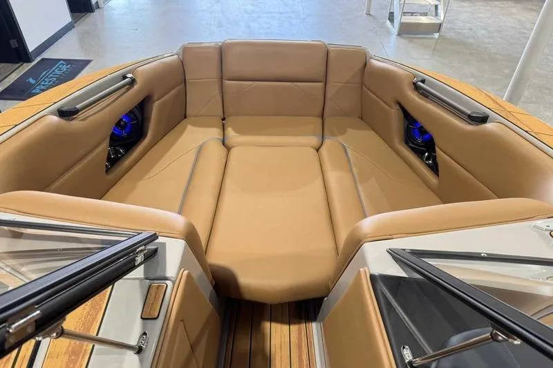 Slide: The Image of 2026 Moomba Mojo boat interior with tan leather seating and modern design. - 11