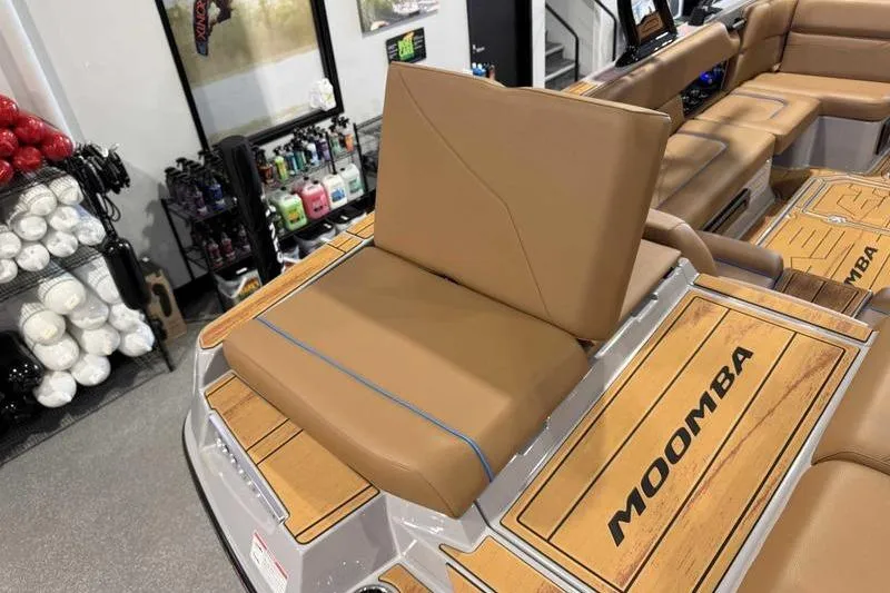 Slide: The Image of 2026 Moomba Mojo boat interior with tan seating and branded flooring. - 4