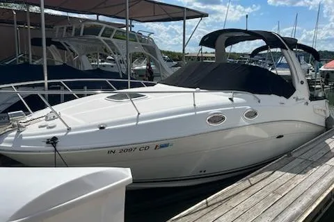 The Image of 2006 Sea Ray 260 Sundancer boat docked under a sunny sky. - 0