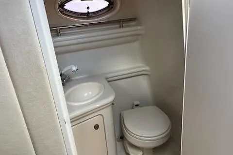 Slide: The Image of 2006 Sea Ray 260 Sundancer boat bathroom with sink and toilet. - 10