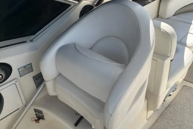 Slide: The Image of White leather seat on 2006 Sea Ray 260 Sundancer boat interior. - 16