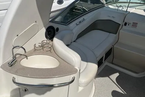 Slide: The Image of 2006 Sea Ray 260 Sundancer interior with sink and seating area. - 19