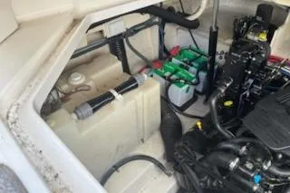 Slide: The Image of Engine compartment of a 2006 Sea Ray 260 Sundancer with visible batteries and components. - 3