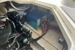 Slide: The Image of Engine compartment of a 2006 Sea Ray 260 Sundancer boat, showing mechanical components. - 4