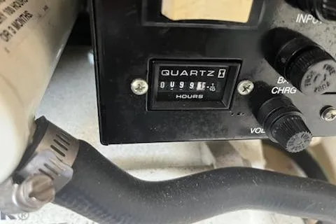 Slide: The Image of Hour meter on 2006 Sea Ray 260 Sundancer boat, showing 99.6 hours. - 6