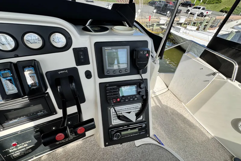 Slide: The Image of Control panel of a 1996 Silverton 372 Motor Yacht with navigation equipment. - 15