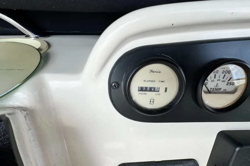Slide: The Image of Dashboard of a 1996 Silverton 372 Motor Yacht showing elapsed time and temperature gauges. - 16
