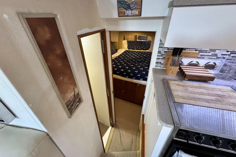 Slide: The Image of Interior of 1996 Silverton 372 Motor Yacht with cozy bedroom and modern kitchen. - 27