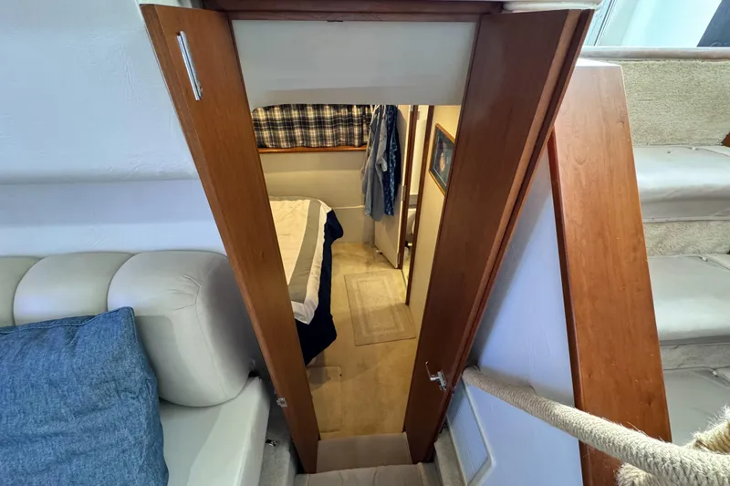 Slide: The Image of Interior view of 1996 Silverton 372 Motor Yacht, featuring cozy cabin entrance. - 33