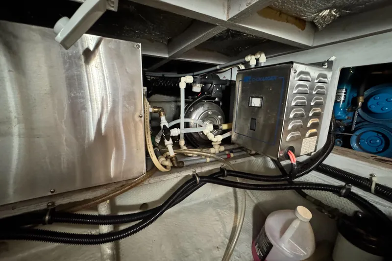 Slide: The Image of Engine room of a 1996 Silverton 372 Motor Yacht with mechanical components. - 40