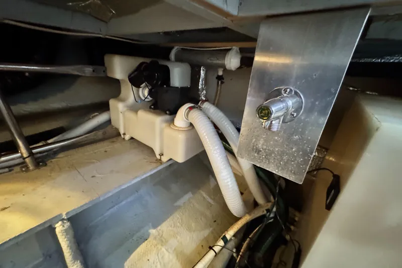 Slide: The Image of Engine room of 1996 Silverton 372 Motor Yacht with visible plumbing and components. - 41